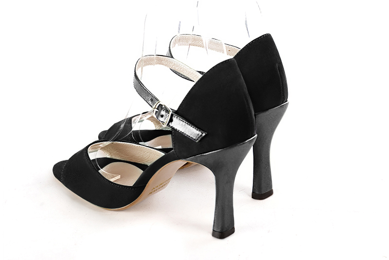 Matt black and dark silver women's closed back sandals, with an instep strap. Round toe. High spool heels. Rear view - Florence KOOIJMAN